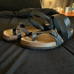 Black strappy sandals.